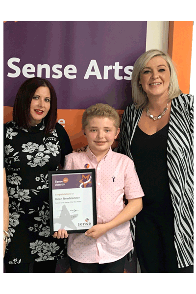 Photograph of pupil receiving his award