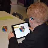 Photograph of a pupil making an animation movie using a school iPad and the Stickbot app