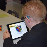 Photograph of a pupil making an animation movie using a school iPad and the Stickbot app