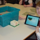 Photograph of a pupil making an animation movie using a school iPad and the Stickbot app