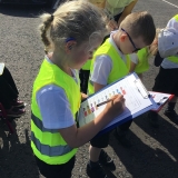 Pupils from class 2 performing a transport survey