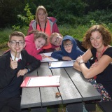 Group picture of staff and pupils at the forest school