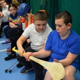 Picture of pupils looking at a hurling stick