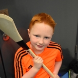 Picture of  a pupil looking at a hurling stick