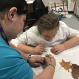 Picture of a staff member and a pupil working in the Art room during Hallow Green day