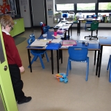 Picture of the Dash robot with its xylophone attached. Programed by students to enter a classroom and play