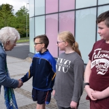 Picture of the Lord Lieutenant of Antrim shaking hands with a pupil