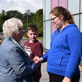 Picture of the Lord Lieutenant of Antrim shaking hands with a pupil