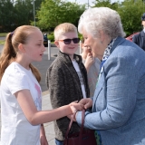 Picture of the  Lord Lieutenant of Antrim shaking hands with a pupil