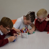 Photographs of pupils discussing and writing down what made them  feel stressed or ‘down’