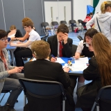 Photograph of staff and pupils discussing and writing down what made them feel stressed or ‘down’