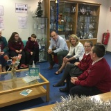 Photograph of the Mrs Joan Christie speaking to the principal, pupils and staff