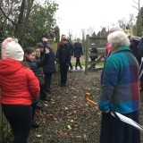 Photograph of Mrs Joan Christiea nd the pupils in the nature reserve