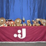 Photograph of the special awards on a display table with the school logo on the front