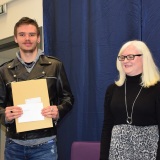 Photograph of Ms Rosaleen Dempsye and a school leaver  with their examination certificate