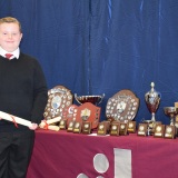 Photograph of a pupil with their character award certificate