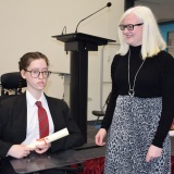 Photograph of Ms Rosaleen Dempsye and a pupil with their character award certificate