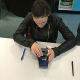 Picture of a pupil safely using a card machine