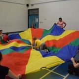 Photograph of pupils playing parachute games