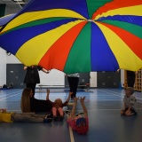 Photograph of pupils playing parachute games