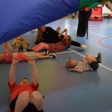 Photograph of pupils playing parachute games