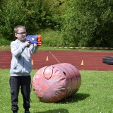 Photograph of a pupil playing with the nerf guns