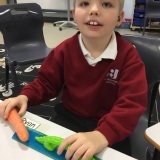 Photograph of a pupil measuring a carrot