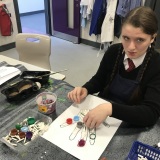 Photograph of a pupil taking part in a tactile art workshop