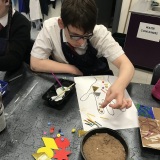 Photograph of a pupil taking part in a tactile art workshop