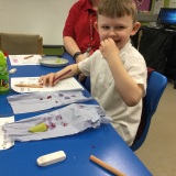 Photograph of a pupil tasting different fruit