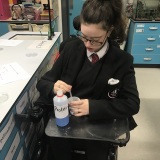 Photograph of a pupil performing a science experiment