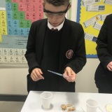 Photograph of a pupil performing a science experiment