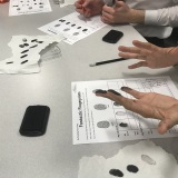 Photograph of pupils taking fingerprints