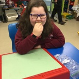 Photograph of a pupil tasting different fruit